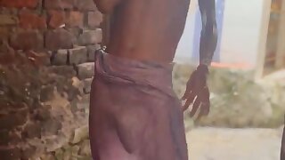 Indian taking a bath outdoor