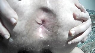 He spreads his ass doggy to show off his ass hole