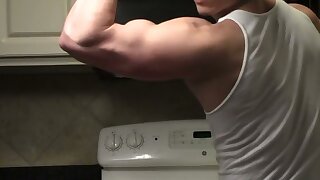 Muscle bro showing off his sexy muscles in a wifebeater.